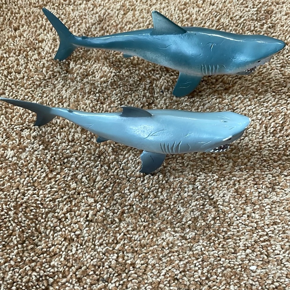 2 Grey plastic shark figurines